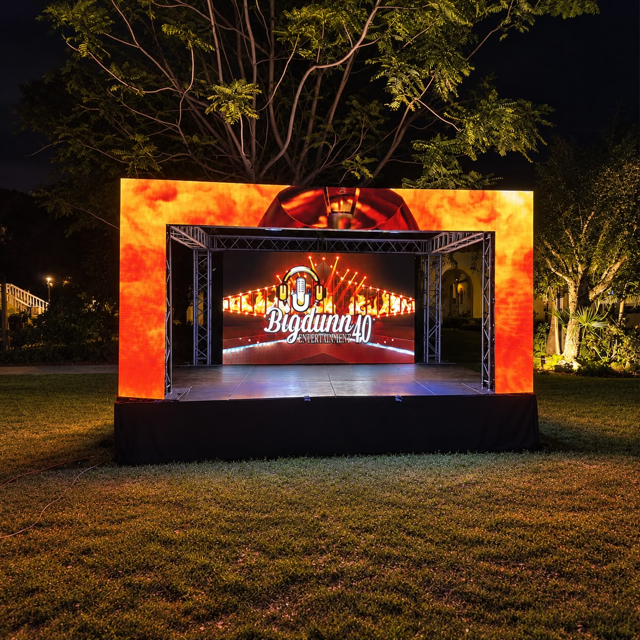 Outdoor stage framed by a large LED video wall
